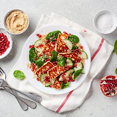 Grilled halloumi, couscous and pomegranate salad with hummus