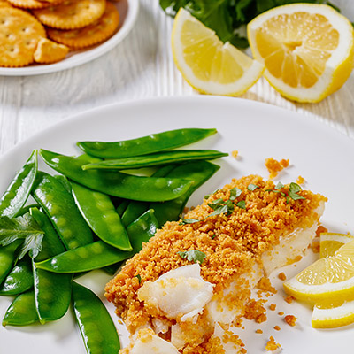 Snow peas: Baked fish with buttery- cracker crust and snow peas